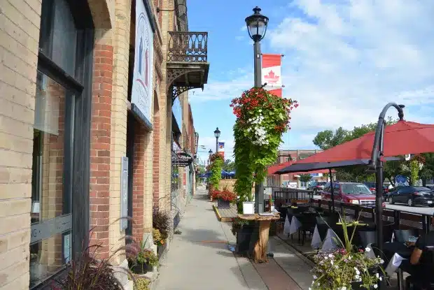 A sidewalk with tables and chairs in front of a restaurant in Meaford.