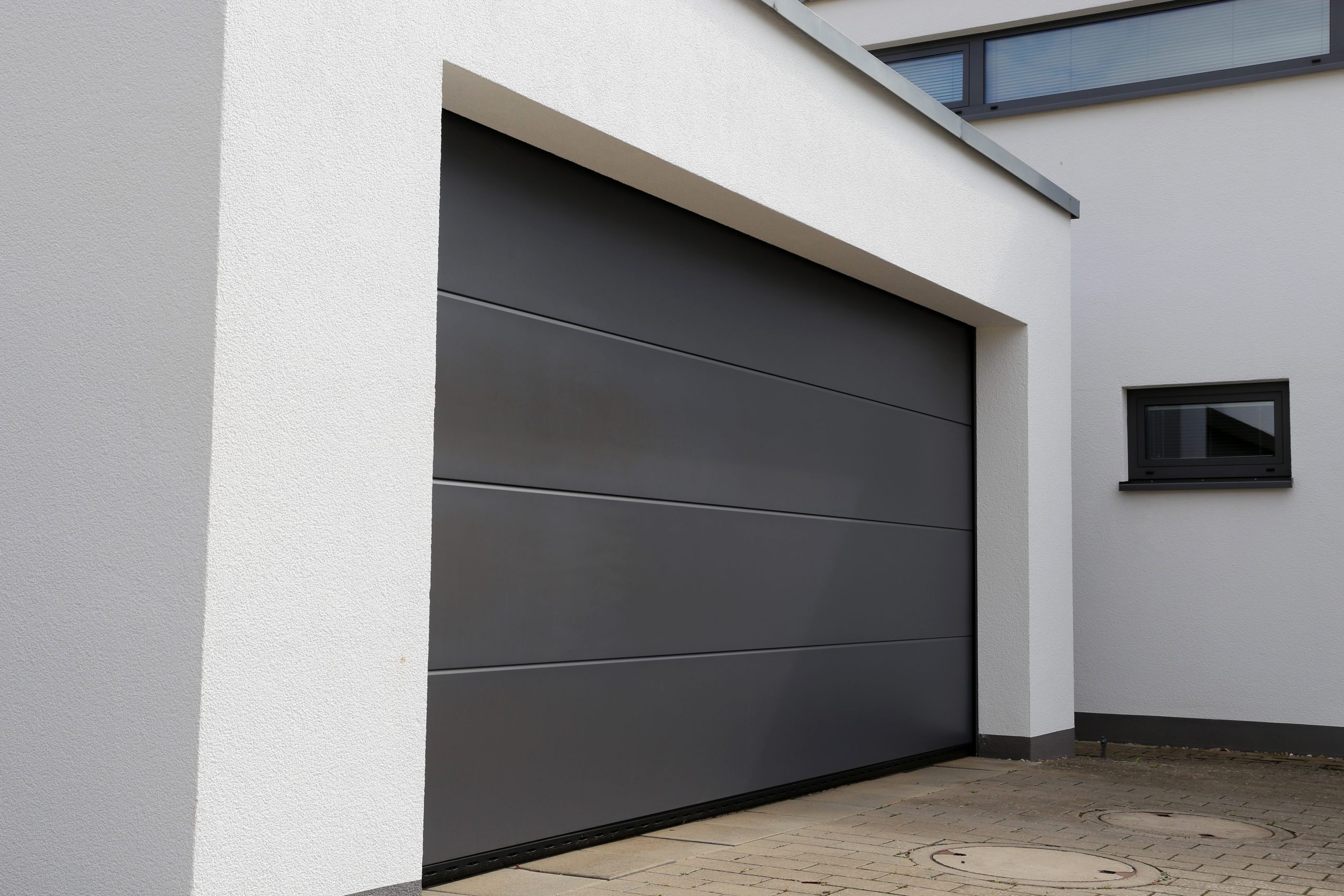A freshly painted image of a garage door in a house.